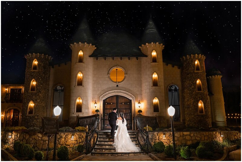 Bride and groom in front of the castle at Wadley Farms at night. Stars are in the sky.