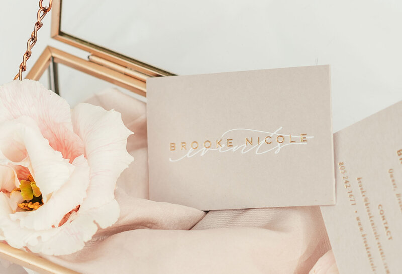 Business cards with gold logo and pink flower for luxury brand design