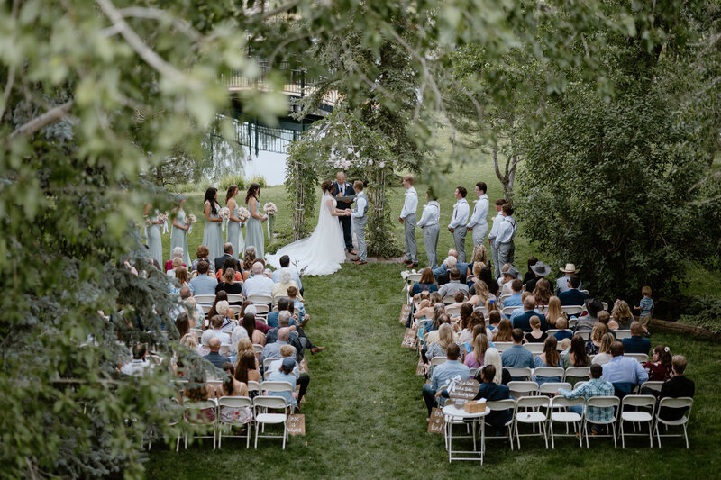 Rustic wedding photos in a Colorado mountain cabin surrounded by natural beauty