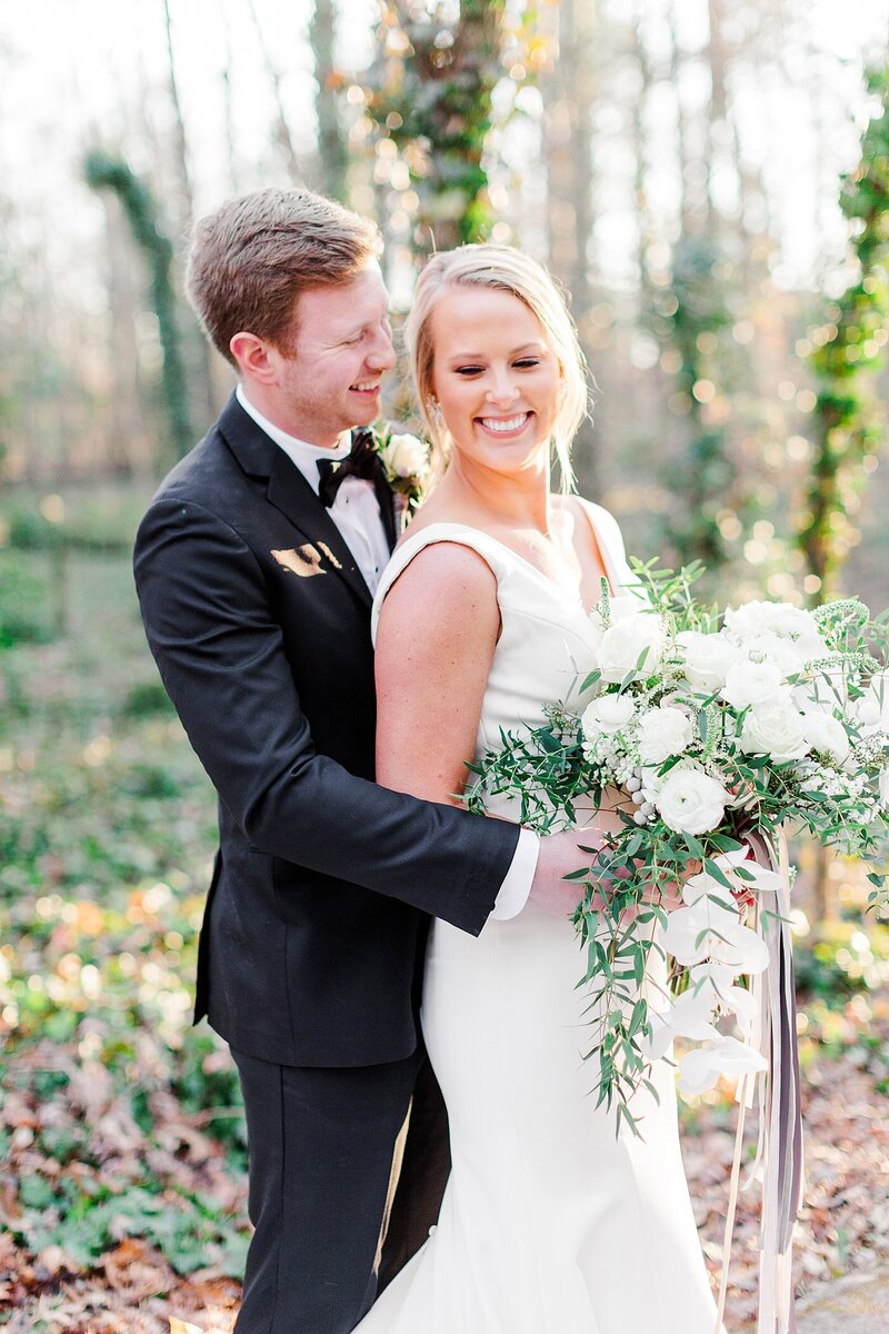bride holding orchid bouquet by Knoxville Wedding Photographer, Amanda May Photos
