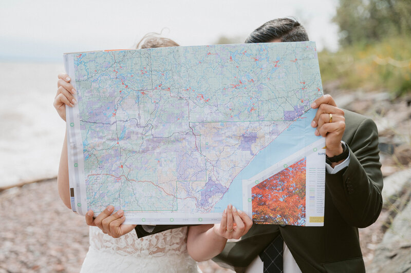 elopement couple hold their dog in their arms