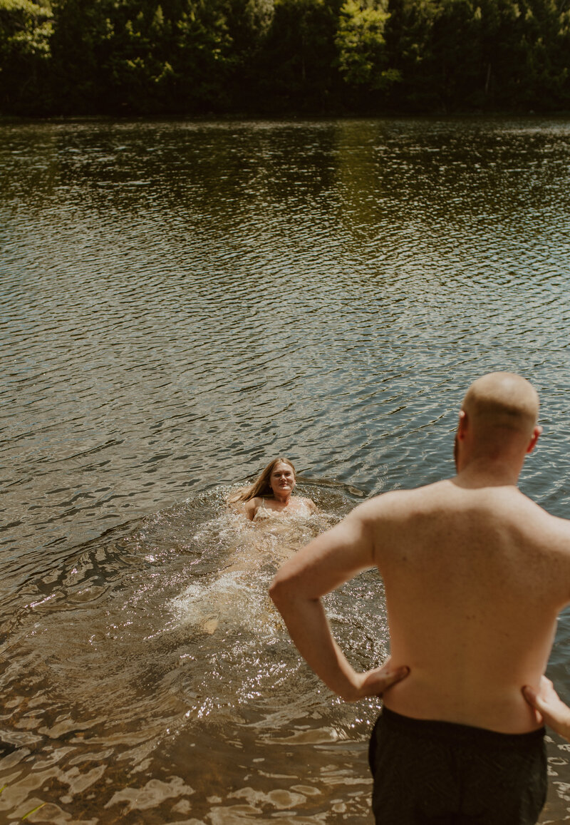 fun summer swimming engagement couple in ontario