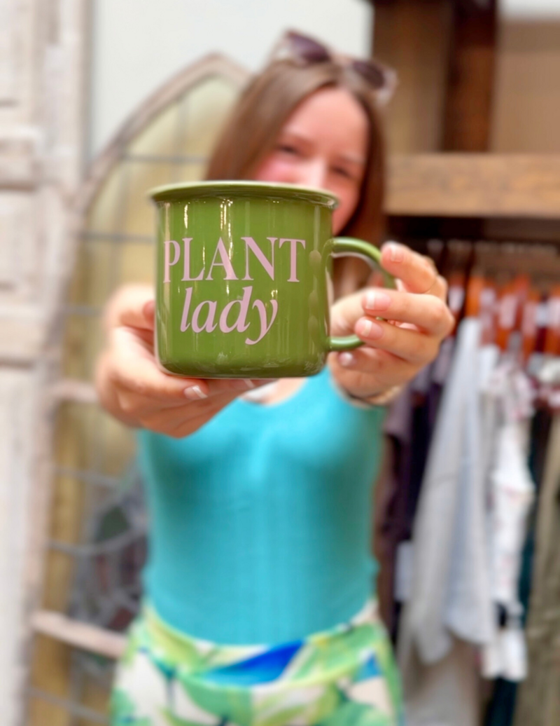 Matilyn holding a cup that says plant lady