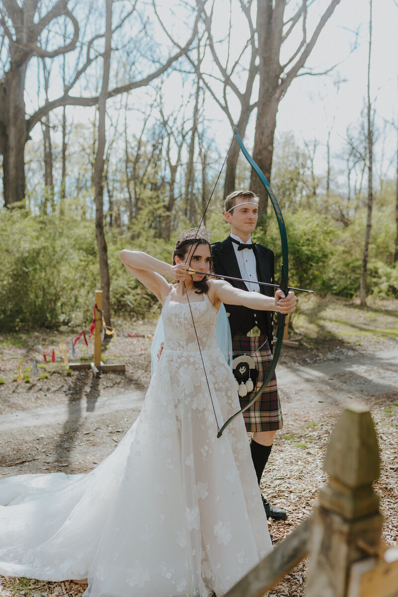lancaster pennsylvania wedding photographer new york new jersey wedding photographer bride and groom photo bride with bow and arrow groom in kilt unique wedding photos fantasy inspired wedding photos unique wedding portraits photo by Emily Avila, the anti-awkward, fun-loving, love-affirming wedding photographer of Central Pennsylvania
