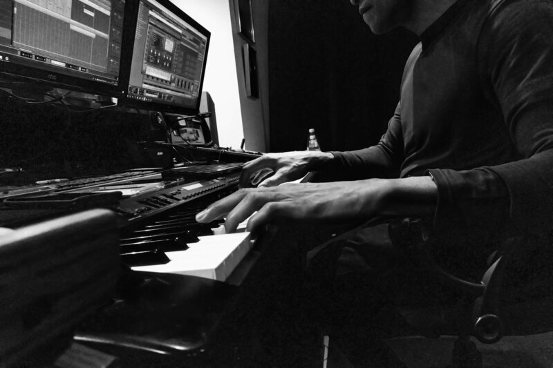 Producer pianist Eddie Bullen making music in home studio