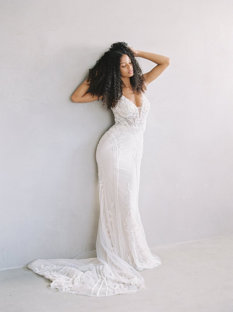 photo of beautiful black bride posing in studio for bridal portraits on film