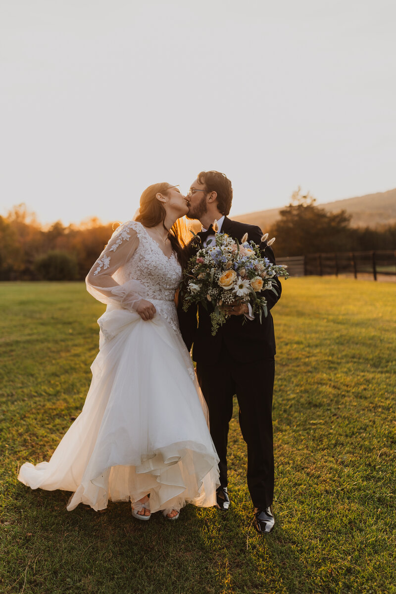 bride and groom kissing in elevator