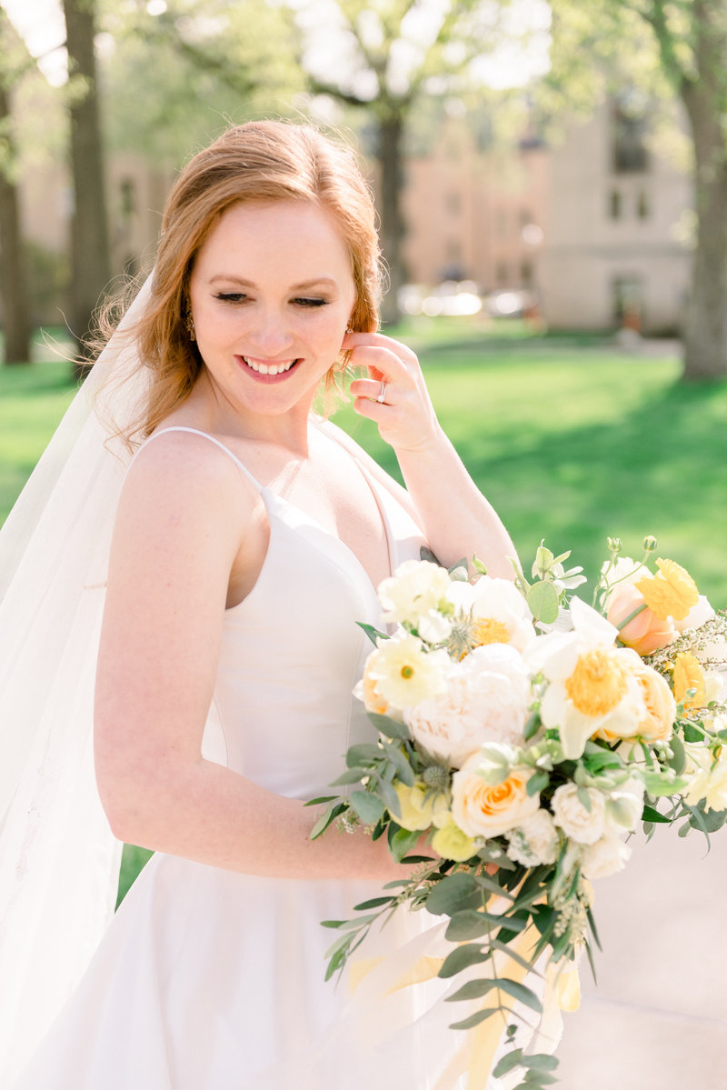 bride holding bouquet created by South Bend Florist