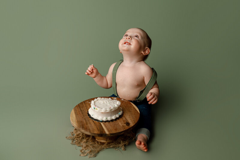 A newborn baby lies on a heart
