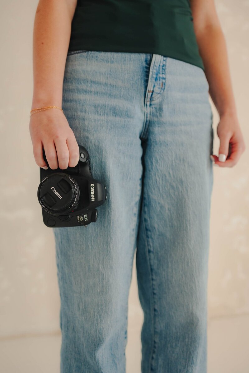 sydney chapman holding camera
