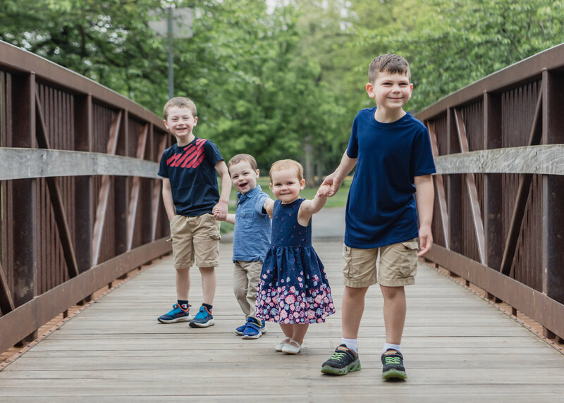 Lifestyle portrait of cousins playing in a Union County, NJ park.