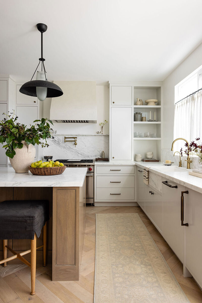 Sleek kitchen island with warm wood tones and functional design elements
