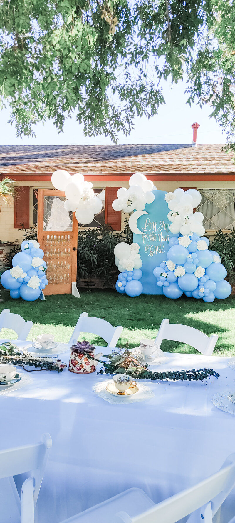 Festive USA balloon arrangement in red, white, and blue with metallic stars and disco balls, perfect for patriotic celebrations and outdoor events.