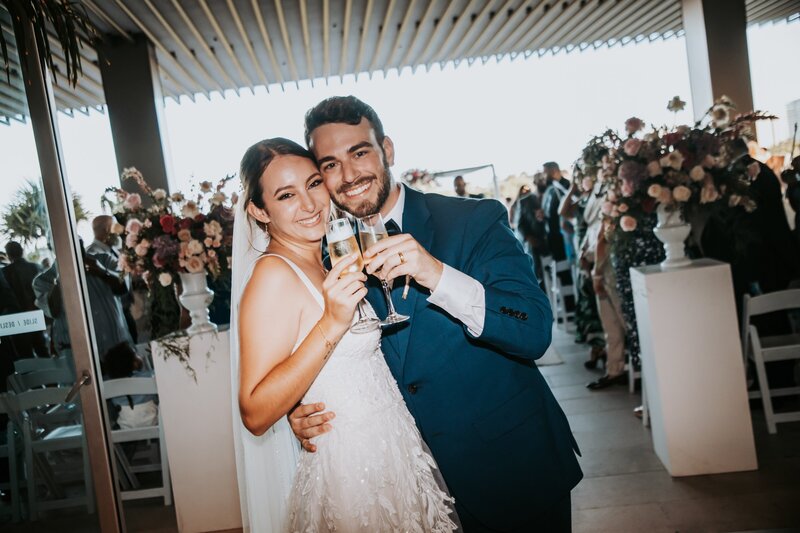 Couple toasting at their Cancun Destination wedding