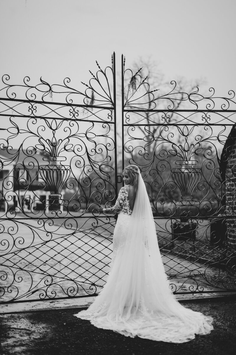 elegant-bride-at-decorative-iron-gate