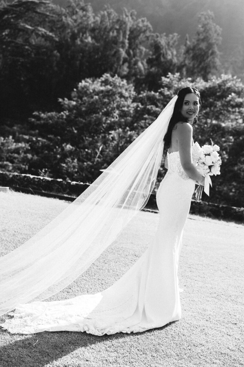 Candid black-and-white shot of couple laughing at Four Seasons Oahu wedding
