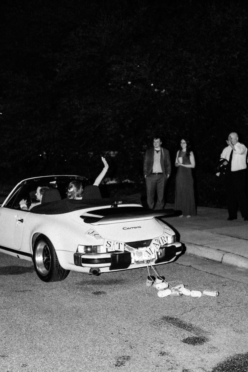 Classic getaway car with "Just Married" decorations outside Colonial Williamsburg wedding, captured by Morgan Renee Photography