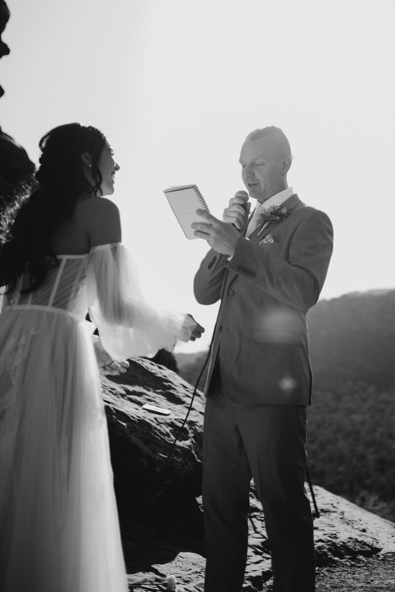 groom reading his vows during sedona elopement