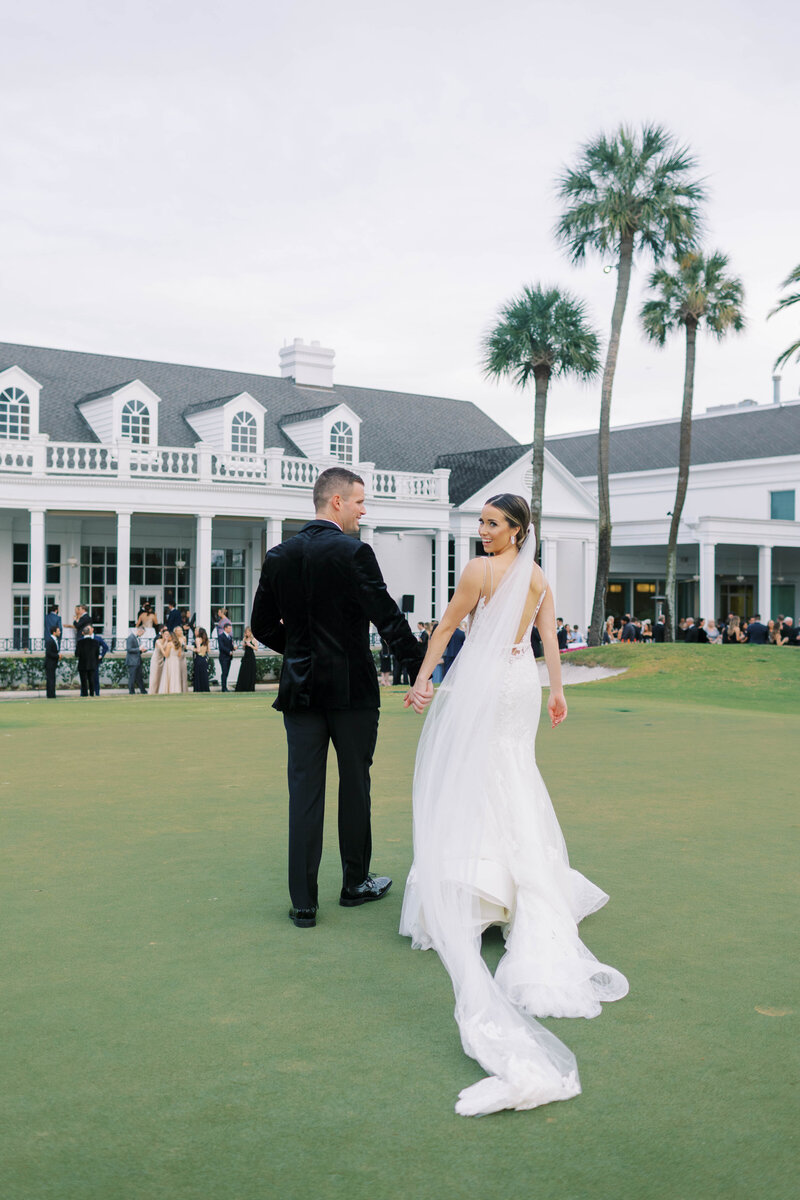 Bride and groom standing outside at luxury outdoor wedding venue Palma CIA