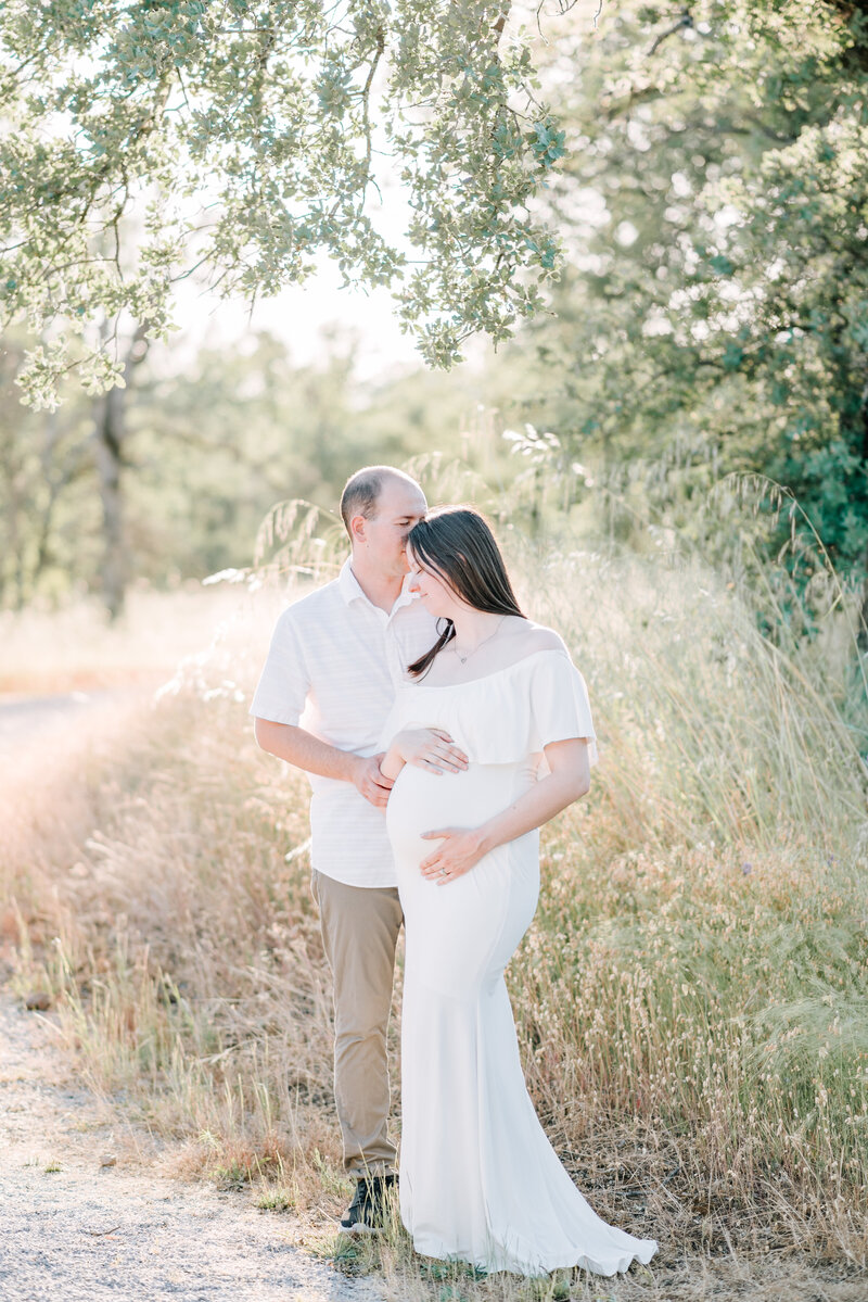 Beautiful, light and airy maternity photo of husband and wife