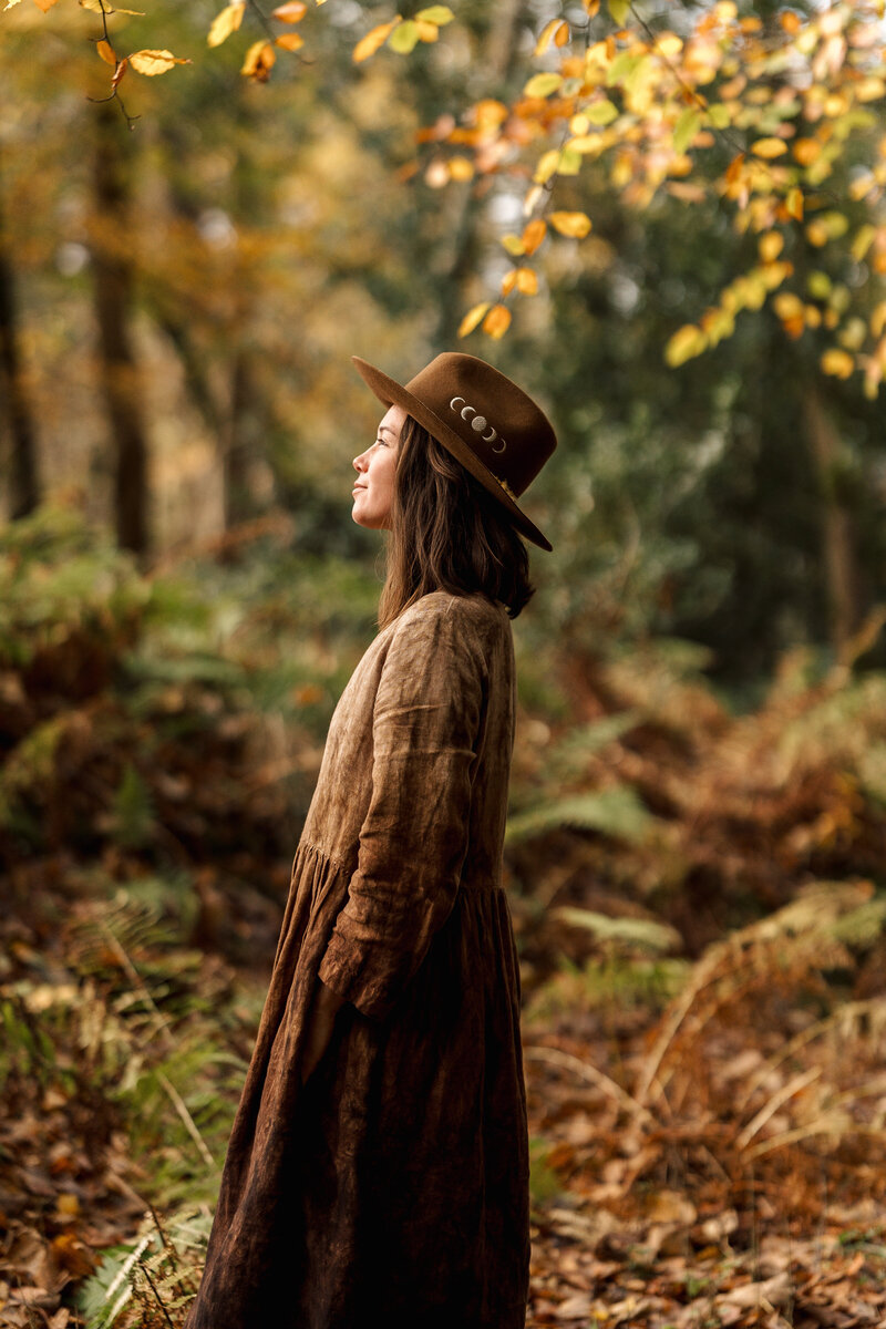 girl standing in forest