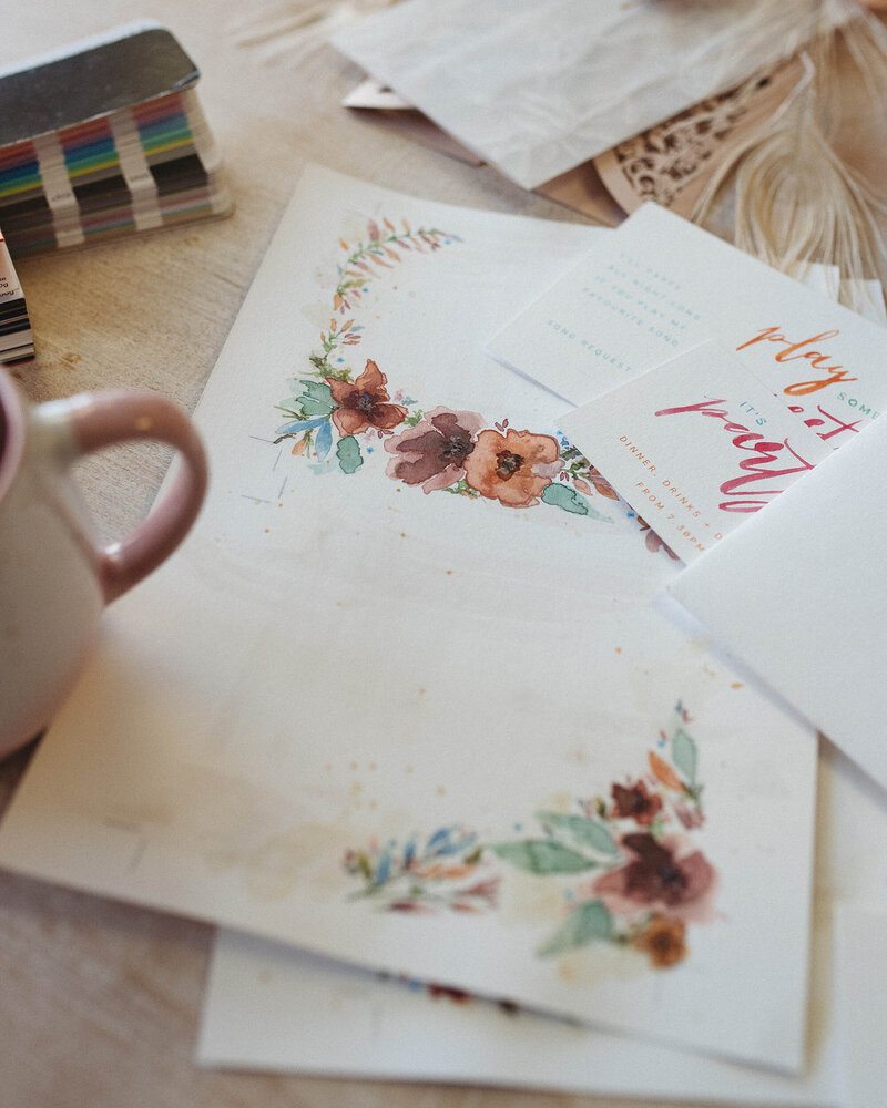 watercolor flowers and hand lettered invitations