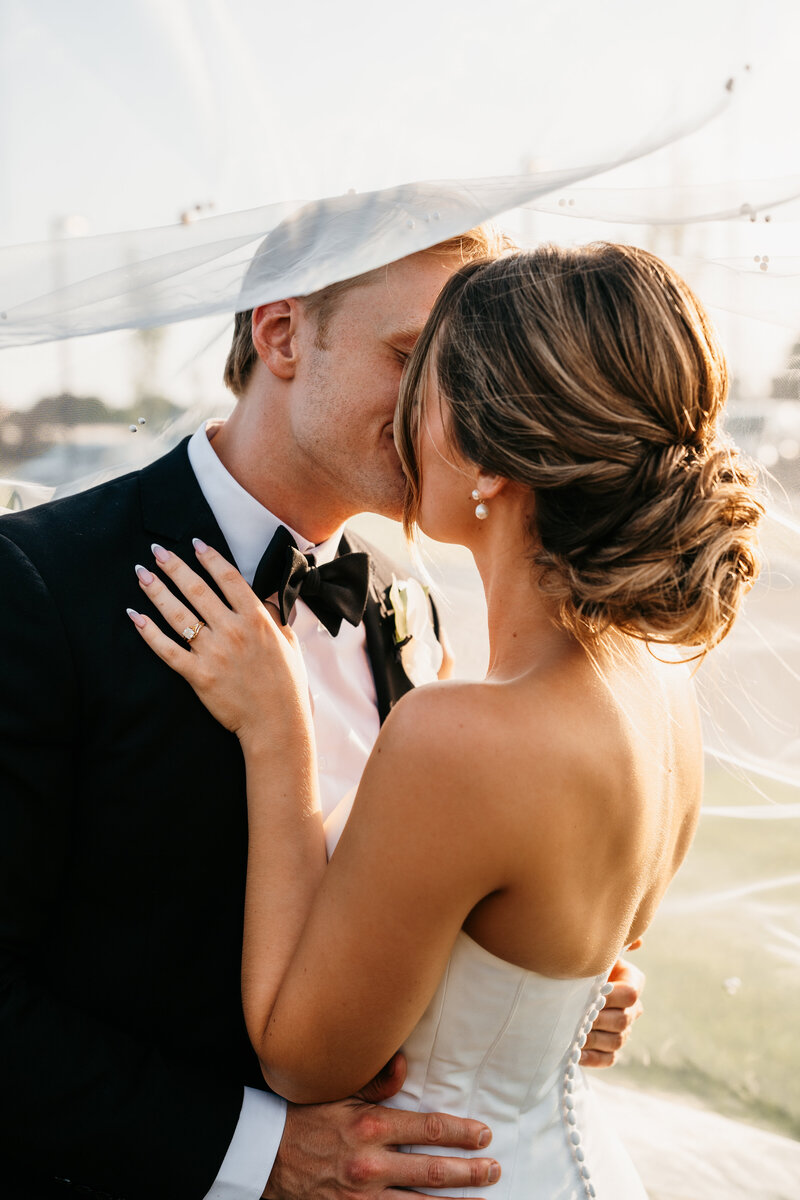 Photo of bride and groom close together, taken by Minnesota Wedding Photographer, Kelly Friday Photography.