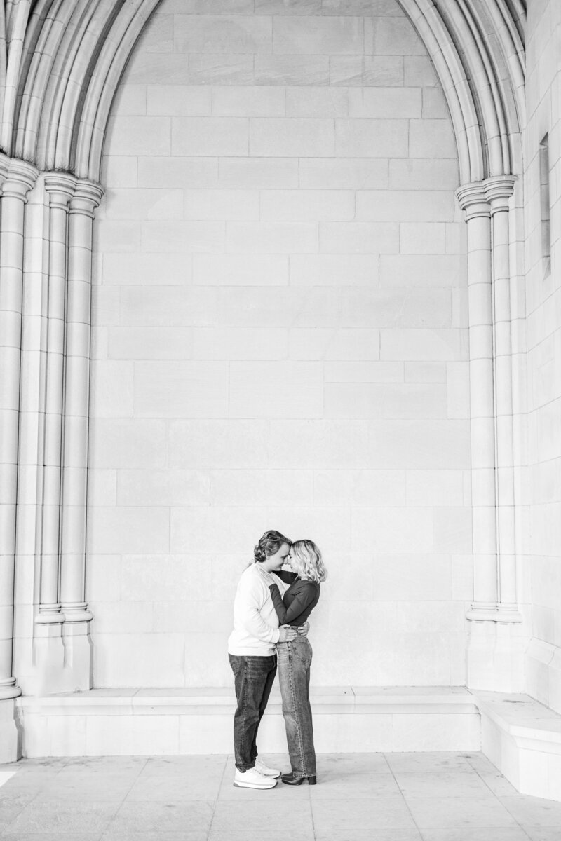 Bridal Portrait Photographer in Atlanta | Bride Smiling in her Wedding Dress Touching her Hair with her Rose Diamond Engagement Ring Prominently Featured