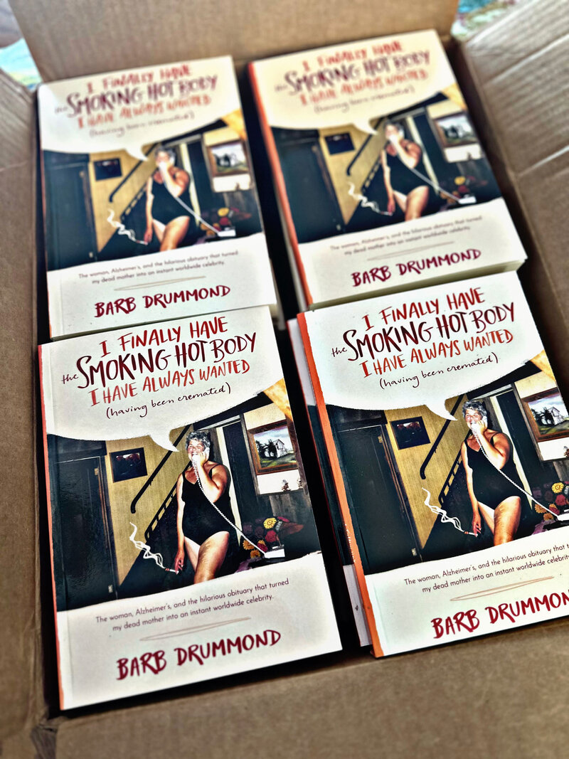 Box filled with copies of Barb's book, "I finally have the Smoking Hot Body I have always wanted (having been cremated)