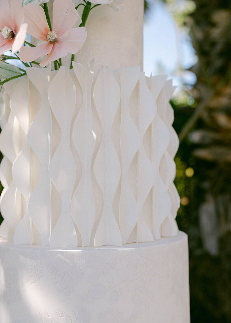3-D wavy texture detail on middle tier of white wedding cake