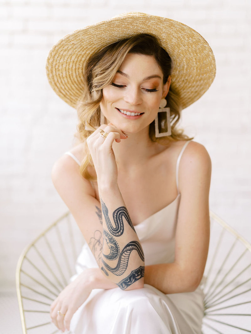 Young Lady with hat and tattoos