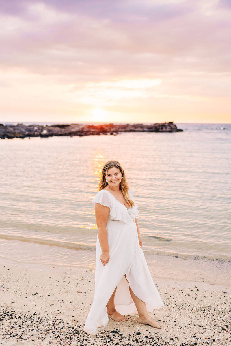 woman walking the beach in Hawaii