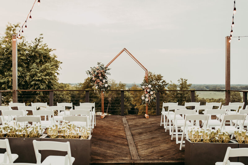 wedding arch and chairs
