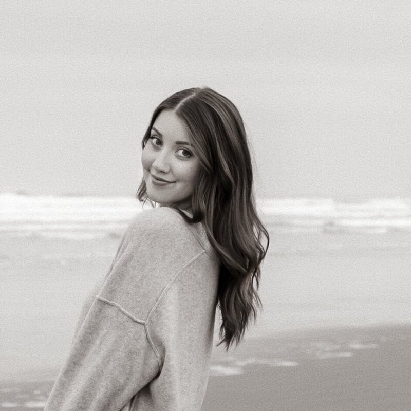 Black and white photo of photographer smiling