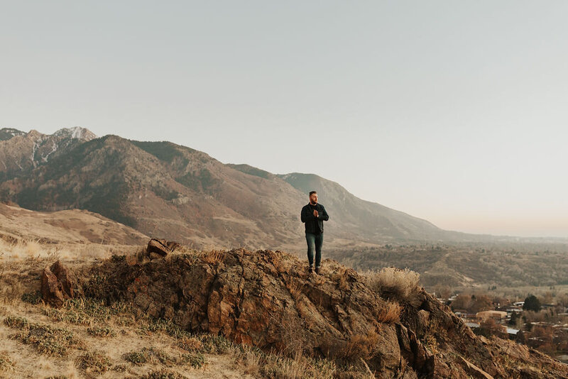 Nick Robertson - man standing on a mountaintop