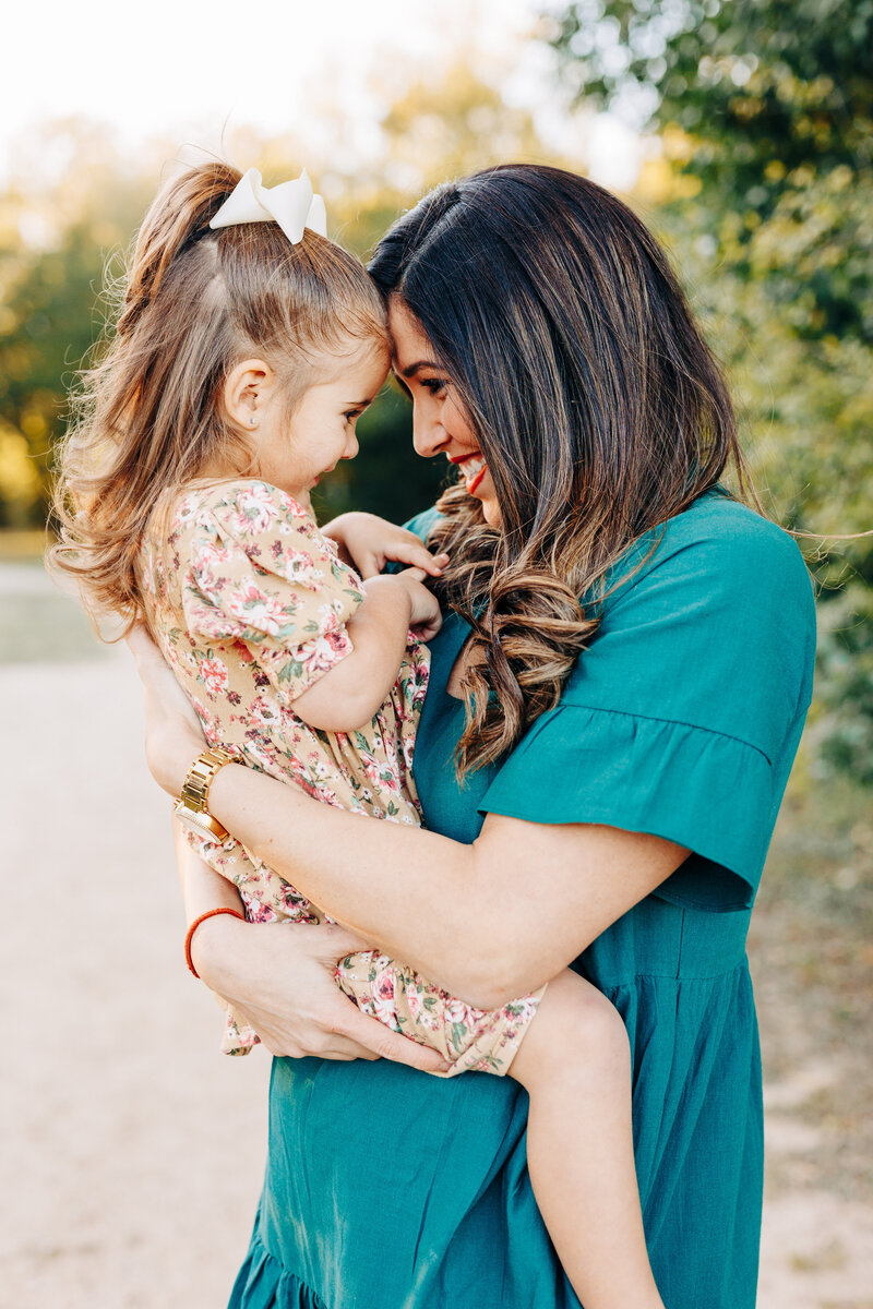 mom with her daughter face to face taken by a houston family photographer