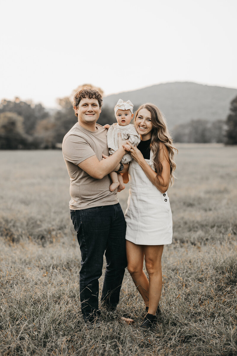 Couple with goldendoodle dog