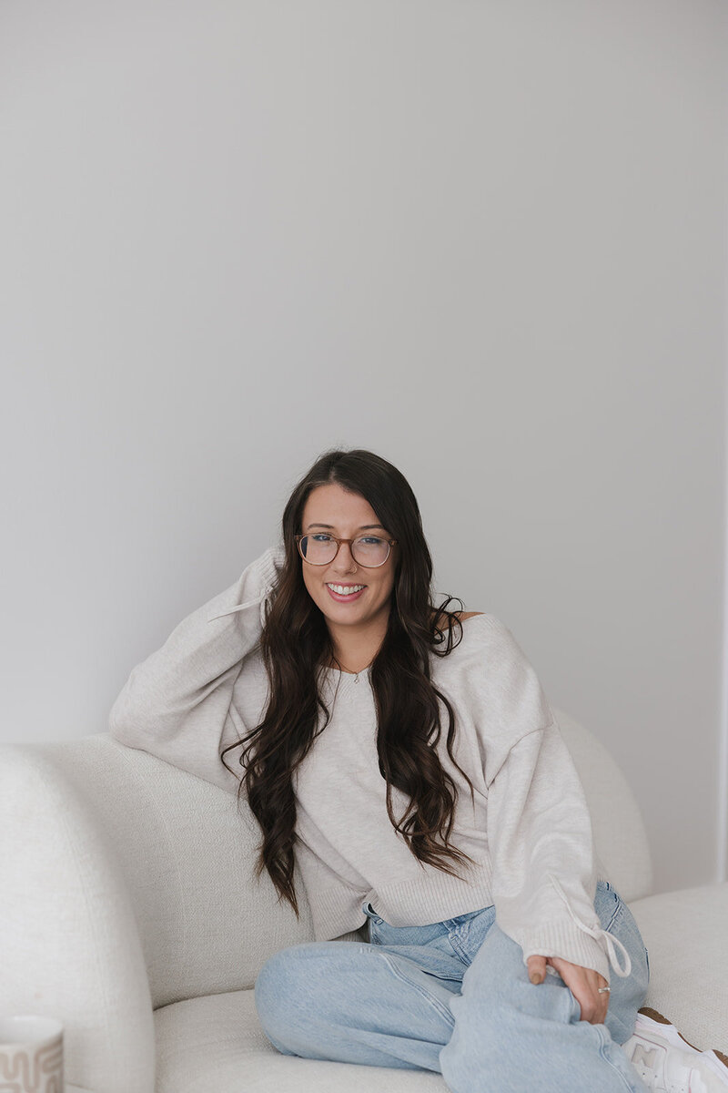 Image of Danielle with glasses smiling