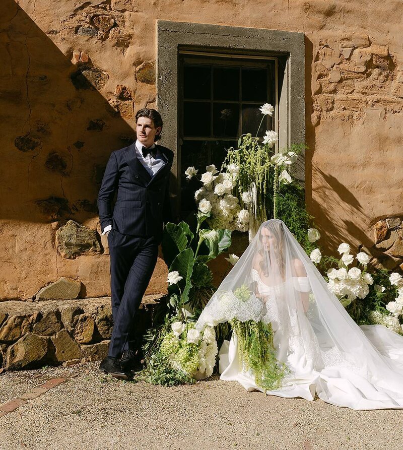 Bride with groom leaning on his shoulder