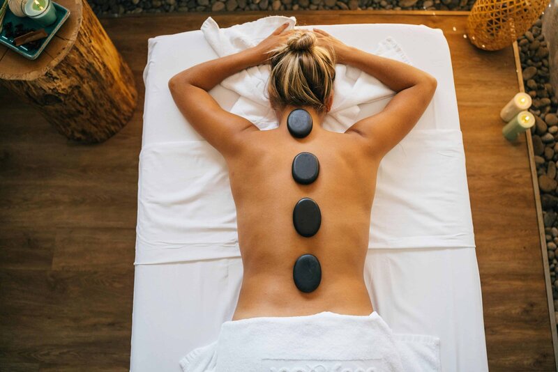 Experience the deep relaxation of a hot stone massage, expertly provided by Devon Denys in Colorado.
