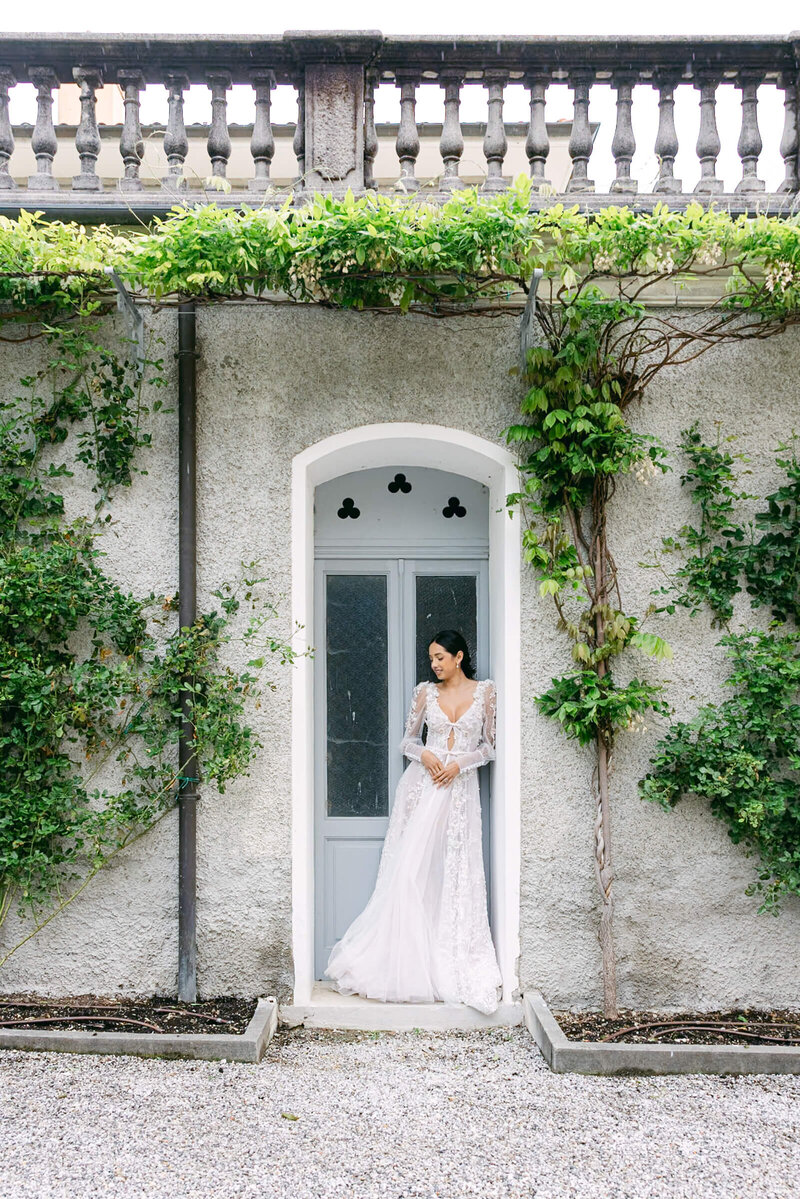 A wedding day bridal photo of the bride in her white dress at villa aura del lago on lake como in italy
