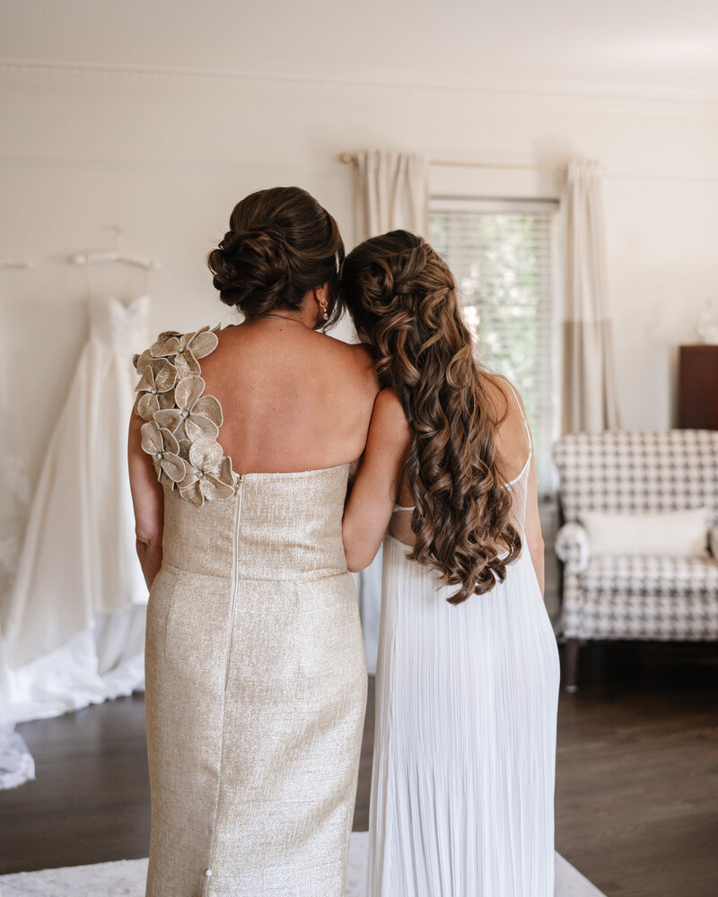 Bride and her mother sharing a heartfelt moment at Greencrest Manor wedding in Michigan