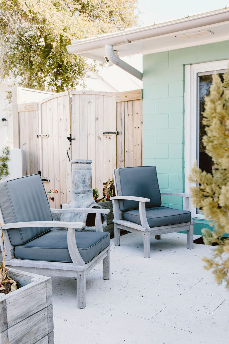 blue outdoor chairs with firepit