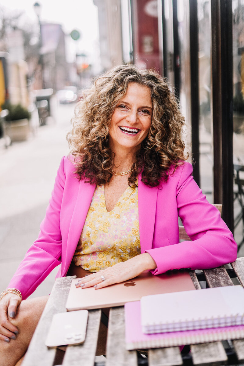 Woman sitting outside with laptop