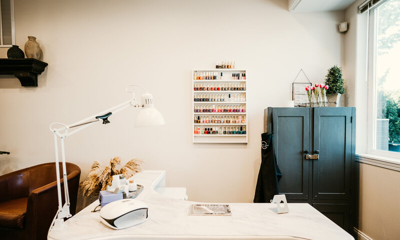 ail polish wall display at Maven + Grace Salon in McMinnville, Oregon featuring a curated range of gel and lacquer shades