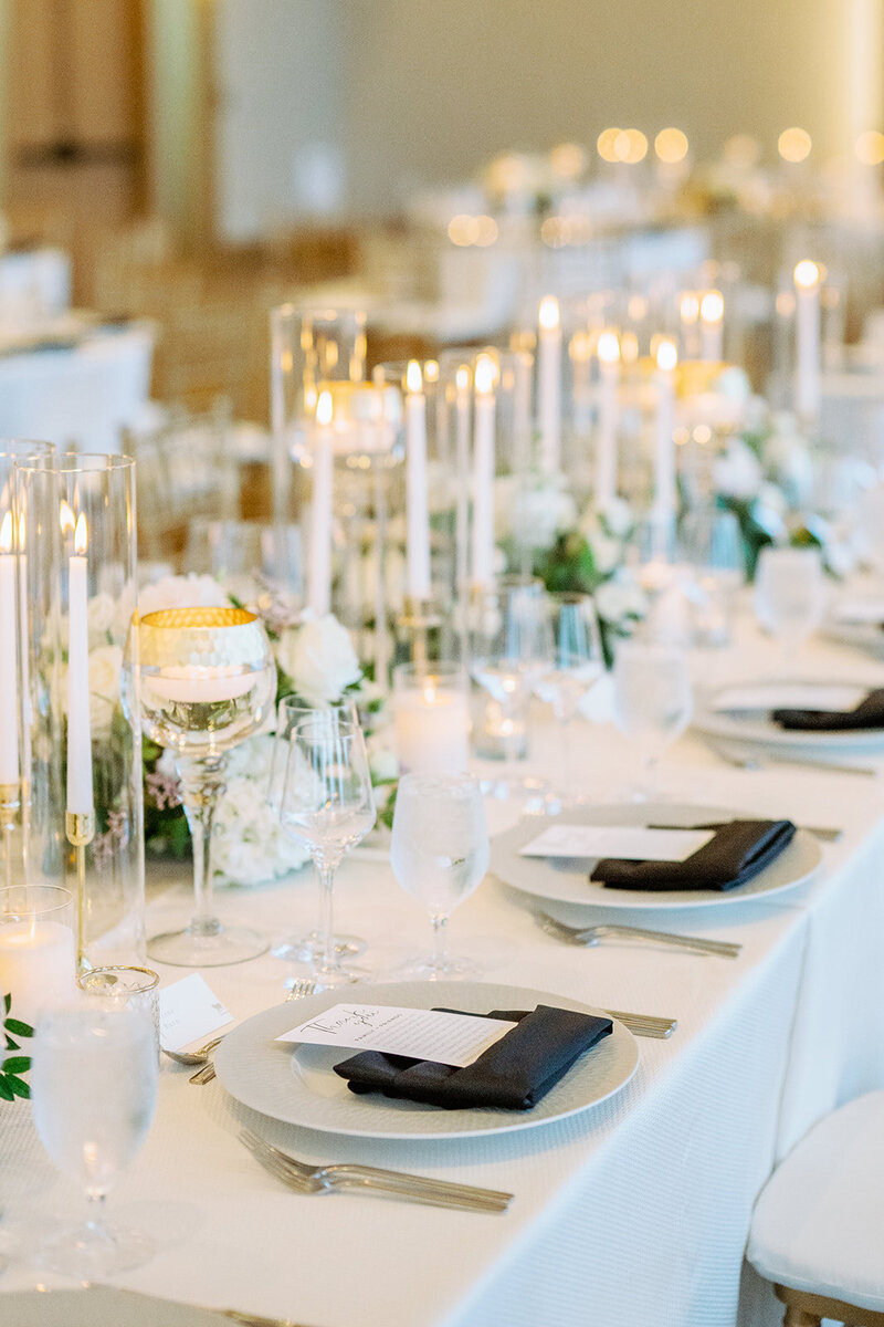 Elegant reception table with candles and lavish florals