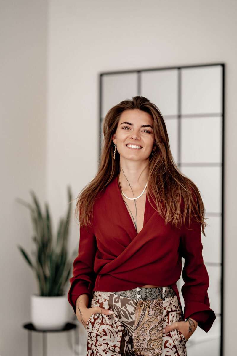 Feminine Embodied Woman's Coach smiling
