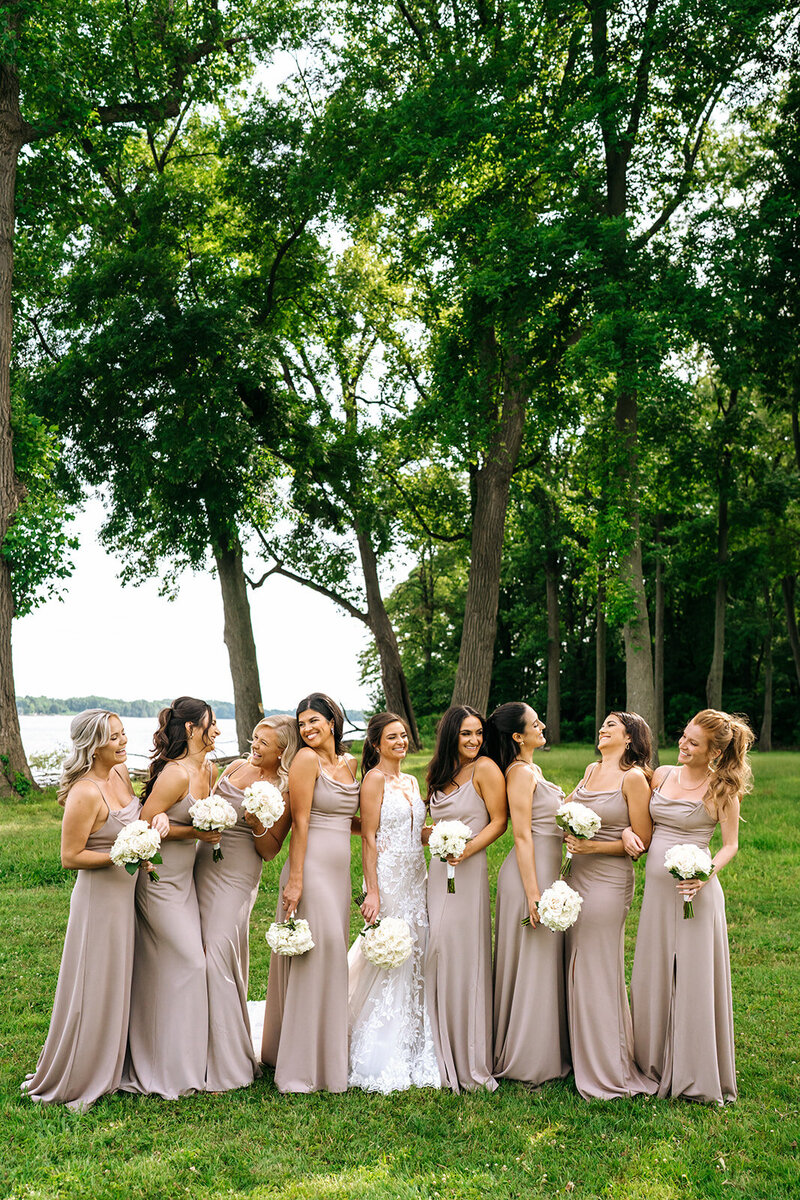 bride with her bridesmaids smiling
