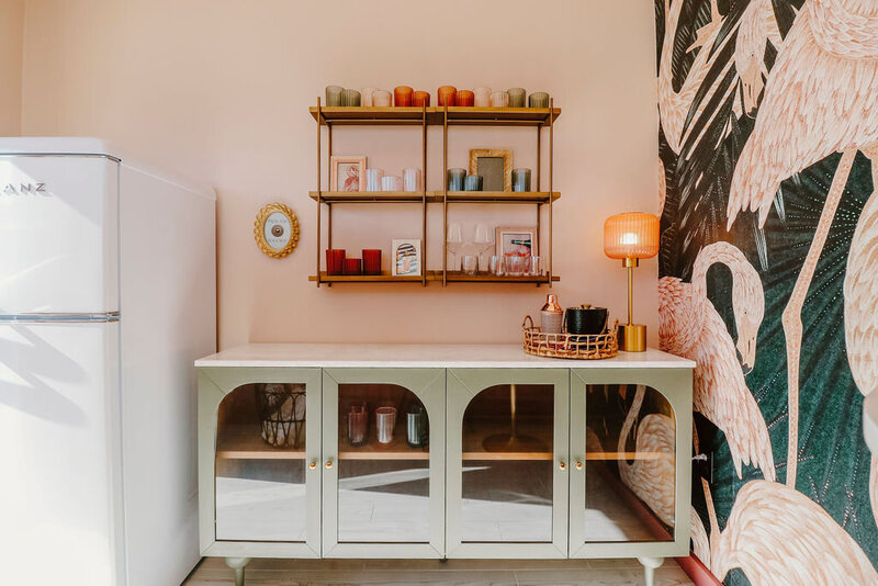 flamingo wallpaper white vintage refrigerator and green credenza with glass doors