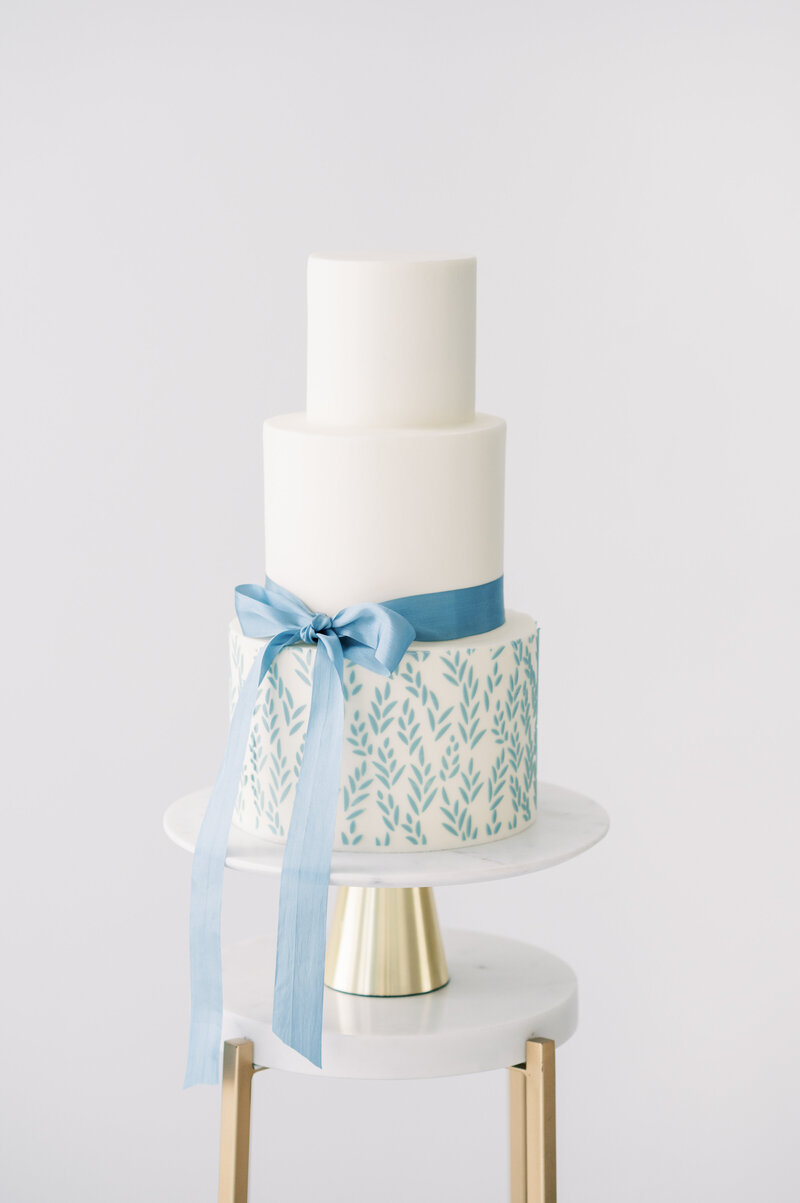 blue and white three tiered wedding cake